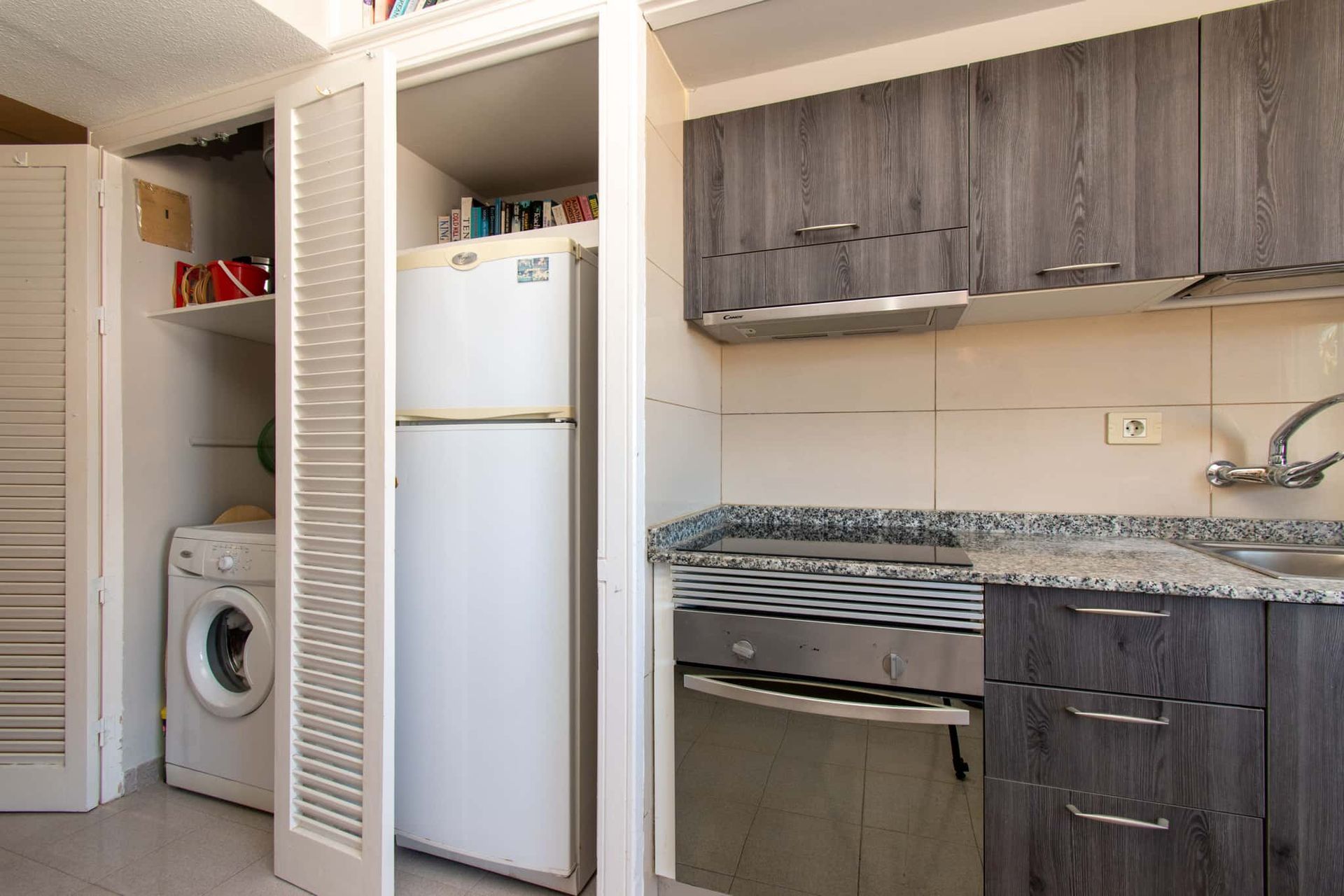 Kitchen with washing machine, tall fridge/freezer, oven, hob, Los Olivos, Costa Adeje, Tenerife.