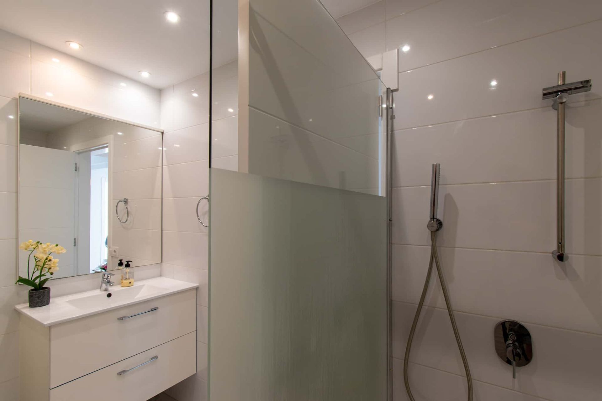 Bathroom with walk-in shower, wash hand basin with mirror above, Club Atlantis, Costa Adeje, Tenerife.