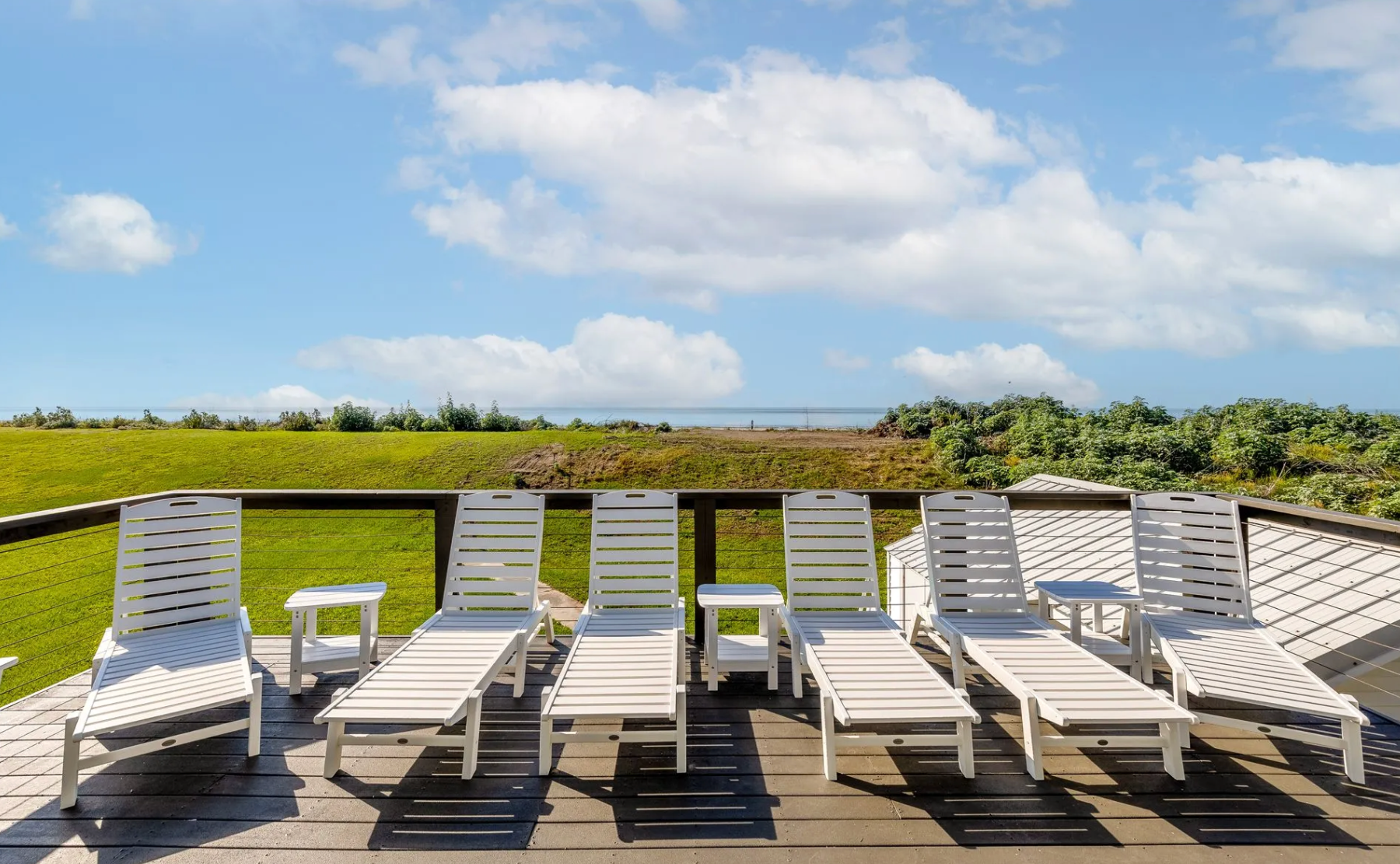 Watch the sunrise over Grand Isle Beach from your gulf front porch, then head down the private path for a day in the surf and sand. This fully remodeled 8-bedroom home gives big groups plenty of space to cook, hang out, and unwind—whether that’s upstairs in the open living areas or downstairs on the covered deck (made for seafood boils and family cookouts). Shops, bars, and restaurants are all within a short walk/drive, making this the perfect beachy getaway spot for the entire crew.