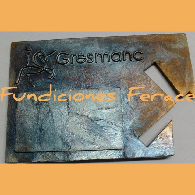 Un trozo de metal con la palabra gresmanc escrita en él.