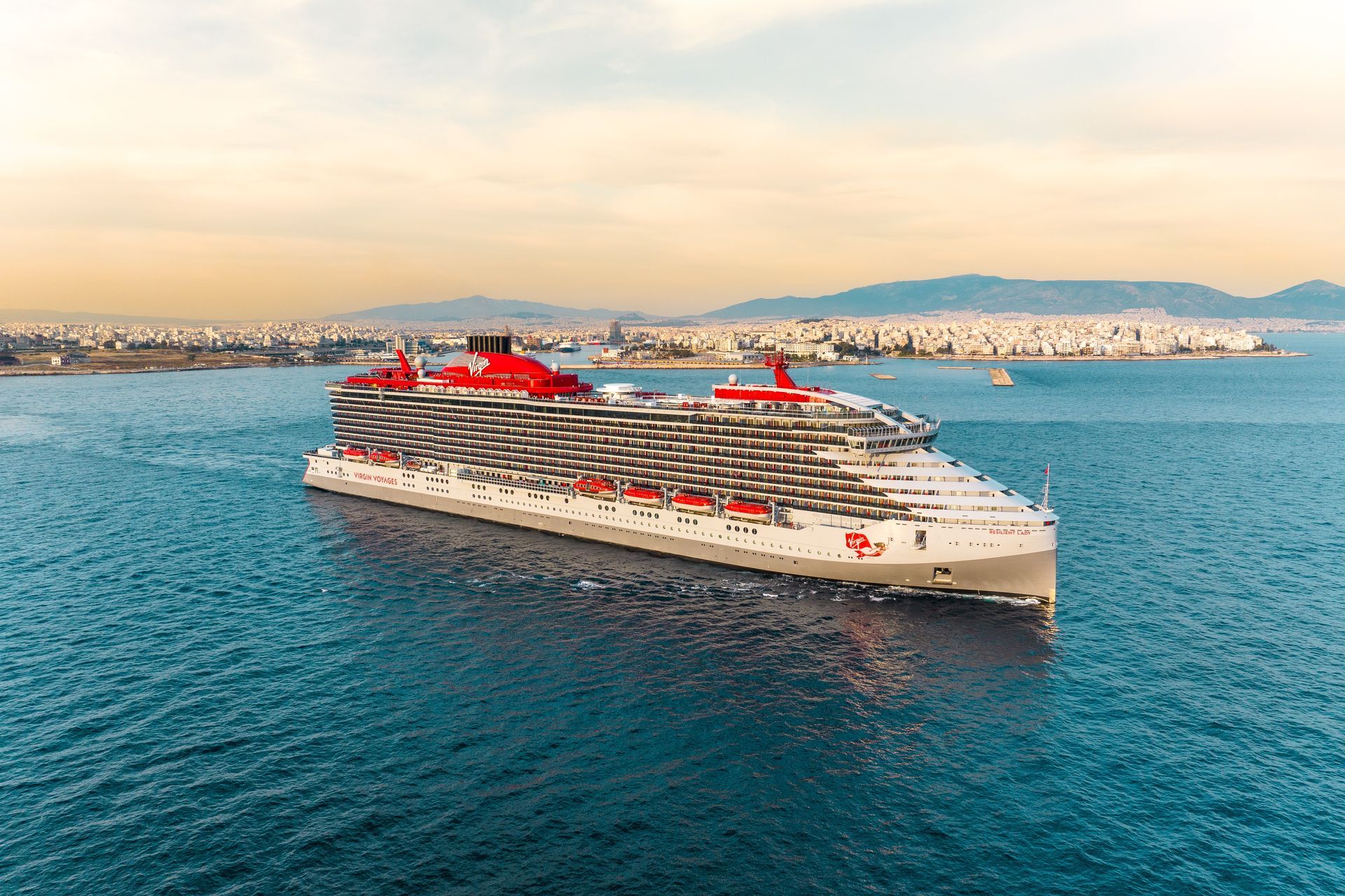 Queen Elizabeth cruise ship sailing at sunset on a Cunard voyage