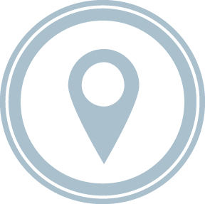 Un alfiler de mapa en un círculo sobre un fondo blanco.