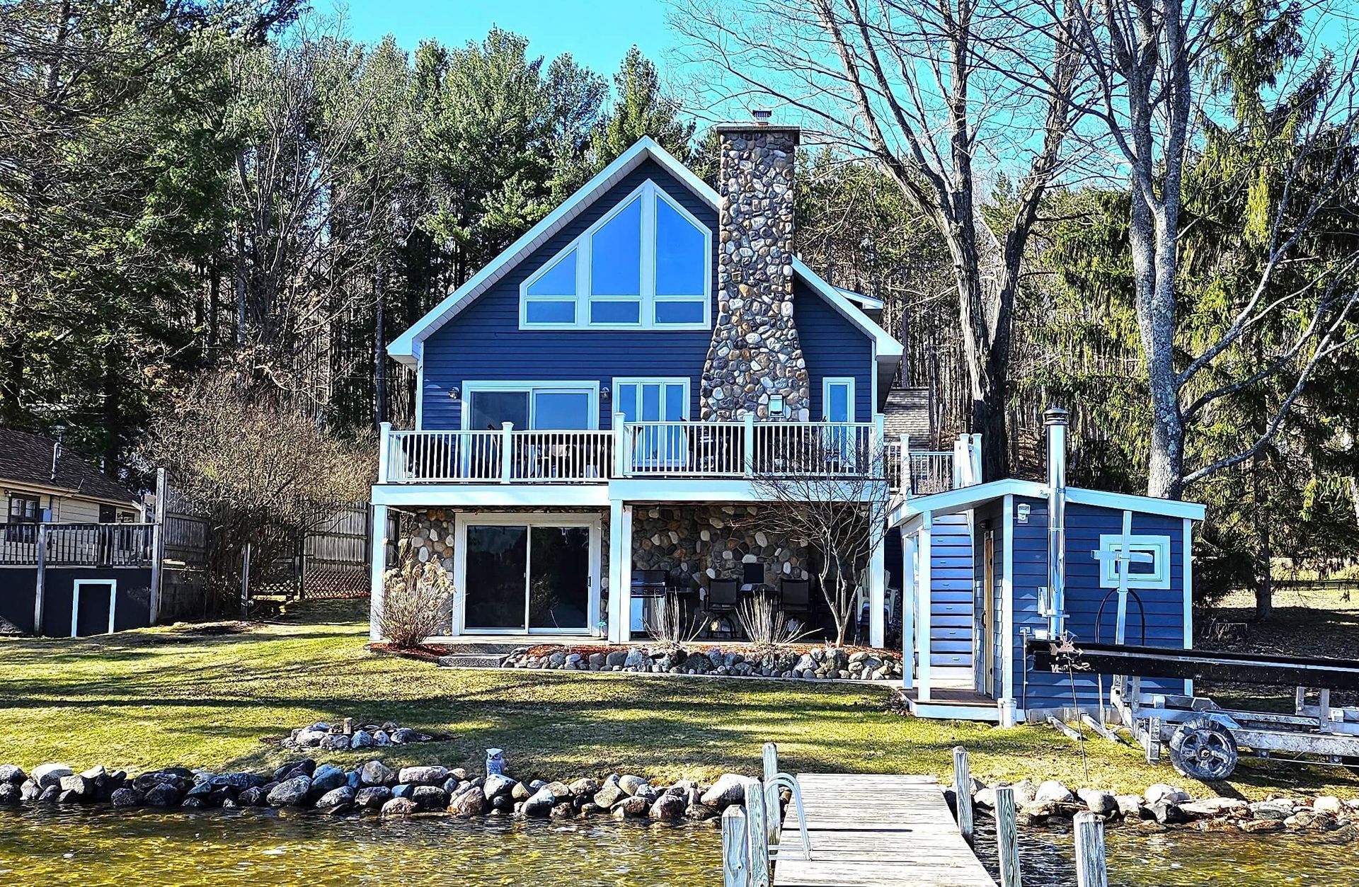 Large blue cottage on lakefront