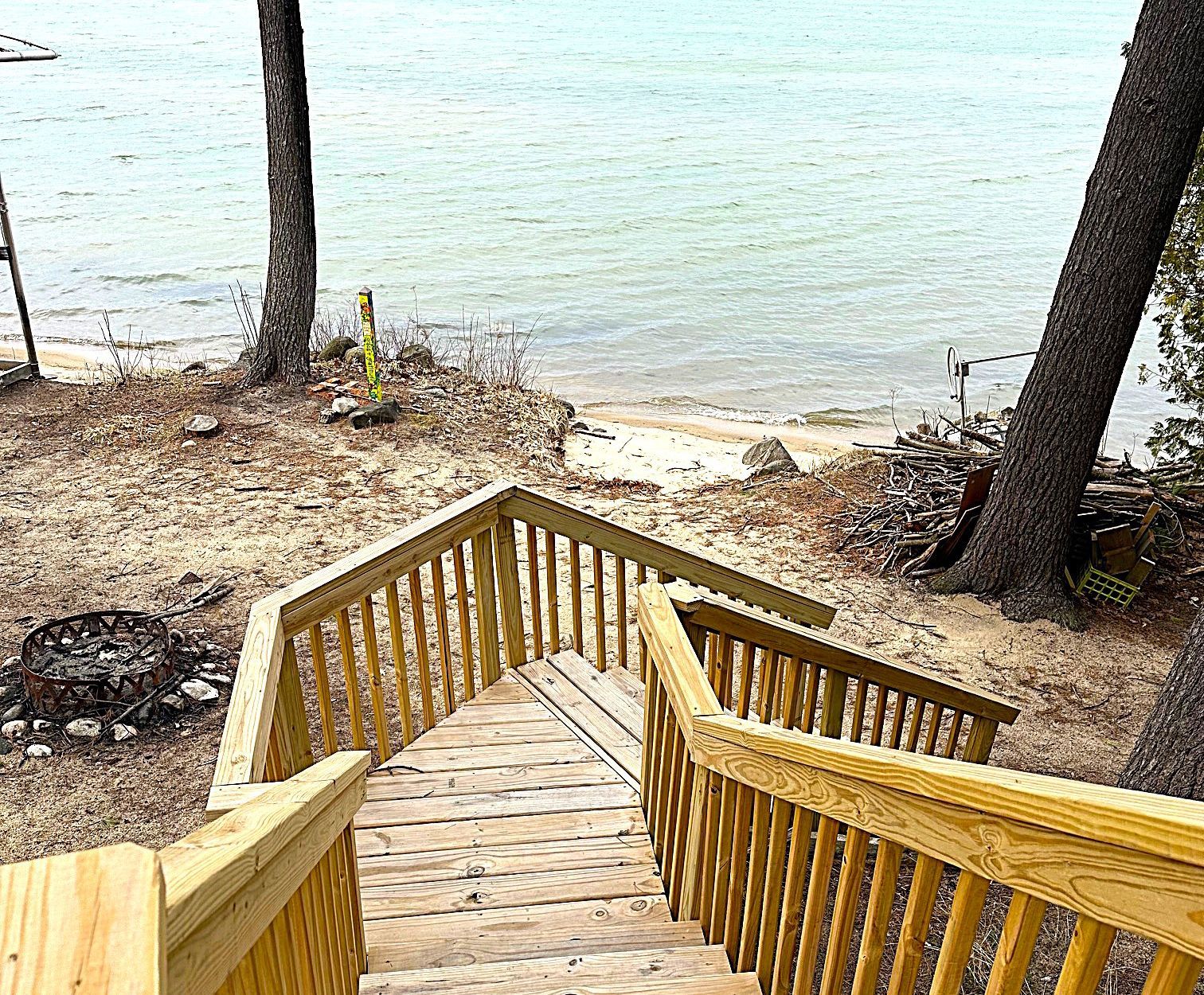 Wooden stairs leading to beachfront access at home