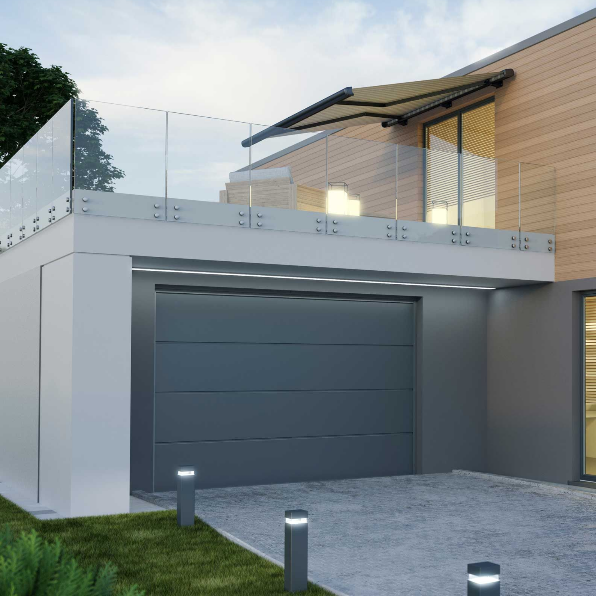 Porte de garage avec une terrasse au-dessus attenante à la maison.