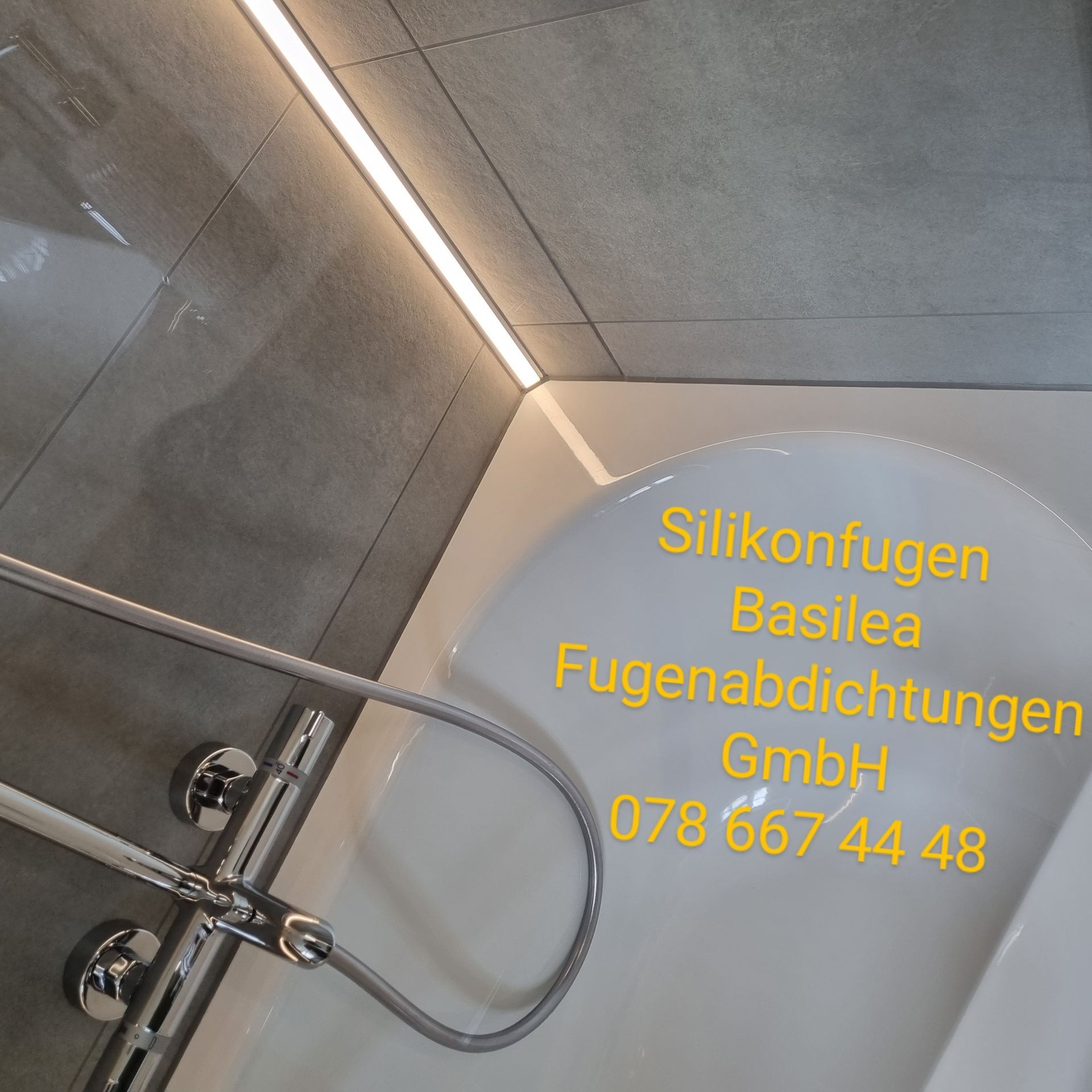 Eine Badewanne mit der Aufschrift „Silikonfugen Basilea Fugenabdichtungen GmbH“