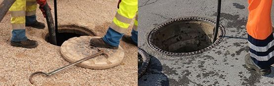 Trabajadores levantando una tapa de alcantarilla con un gancho de metal junto a una alcantarilla abierta.