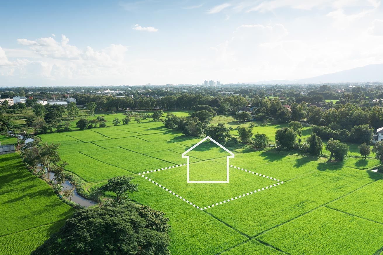 Bornage d'un terrain dans un champs à coté d'une rivière