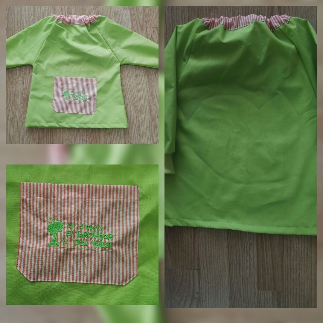 Una camisa verde con un bolsillo de rayas en la parte delantera.