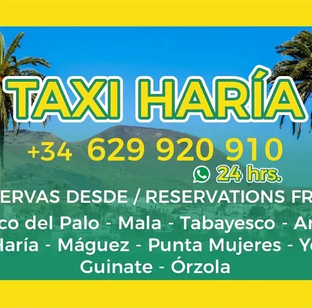 Una señal amarilla y verde para taxi haria