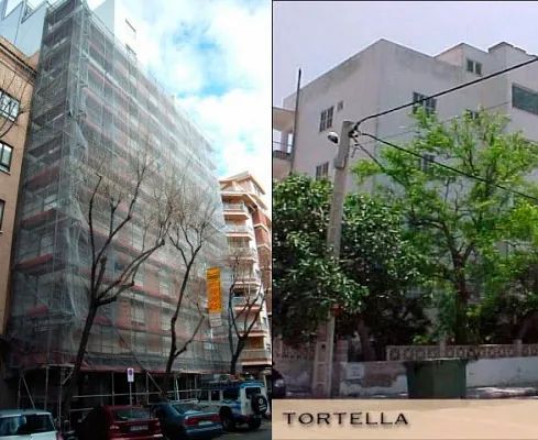 Un edificio con andamios y un cartel que dice tortella
