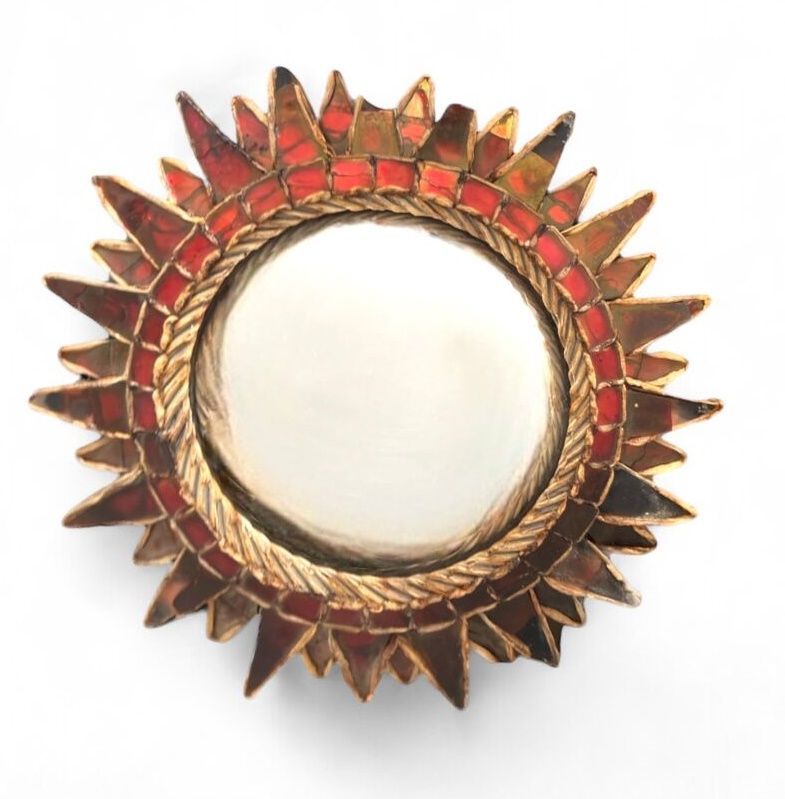 Miroir en forme de soleil à pointe.