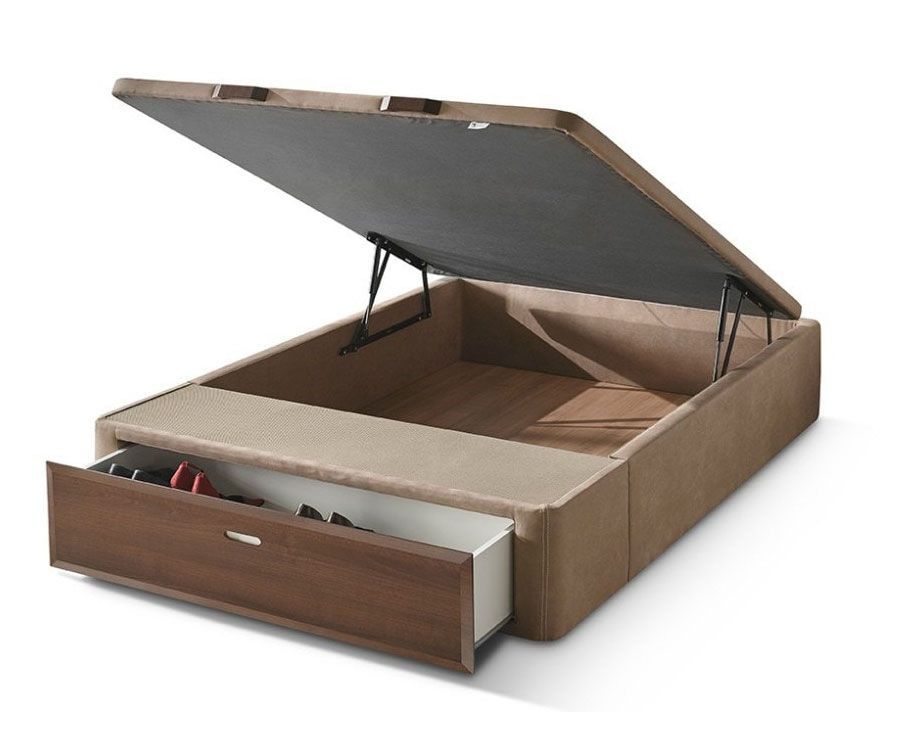 Una cama con la tapa abierta y un cajón debajo.
