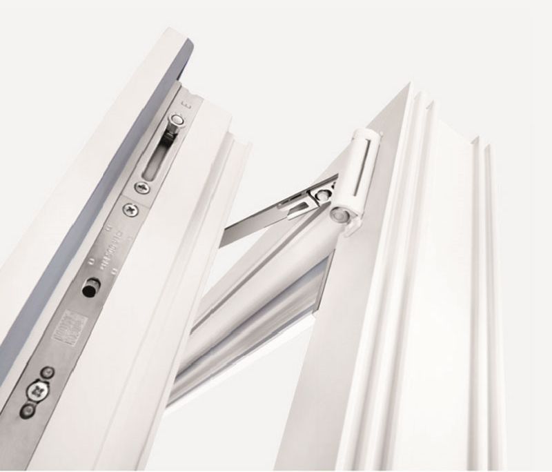 Eine Nahaufnahme eines weißen Fensters mit einer Schraube darauf