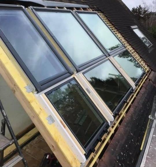 Fenêtres de toit couvrant tout un pan de toiture