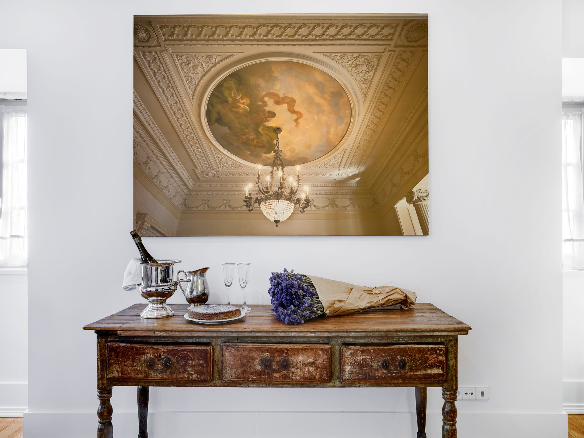 Elegant artwork and vintage decor in a spa deluxe two-bedroom apartment.