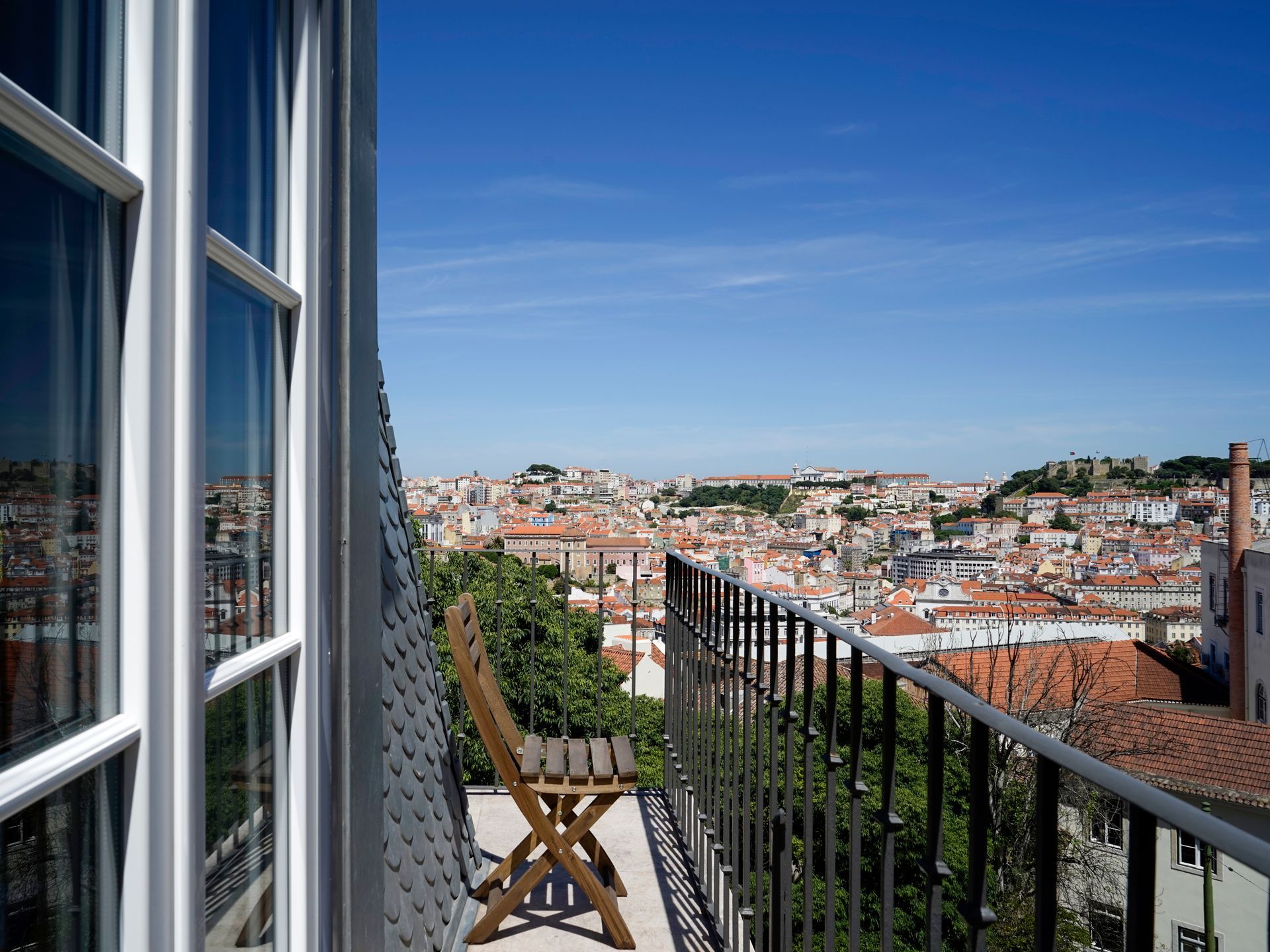 Stunning view of Lisbon from a penthouse two-bedroom apartment with panoramic windows.