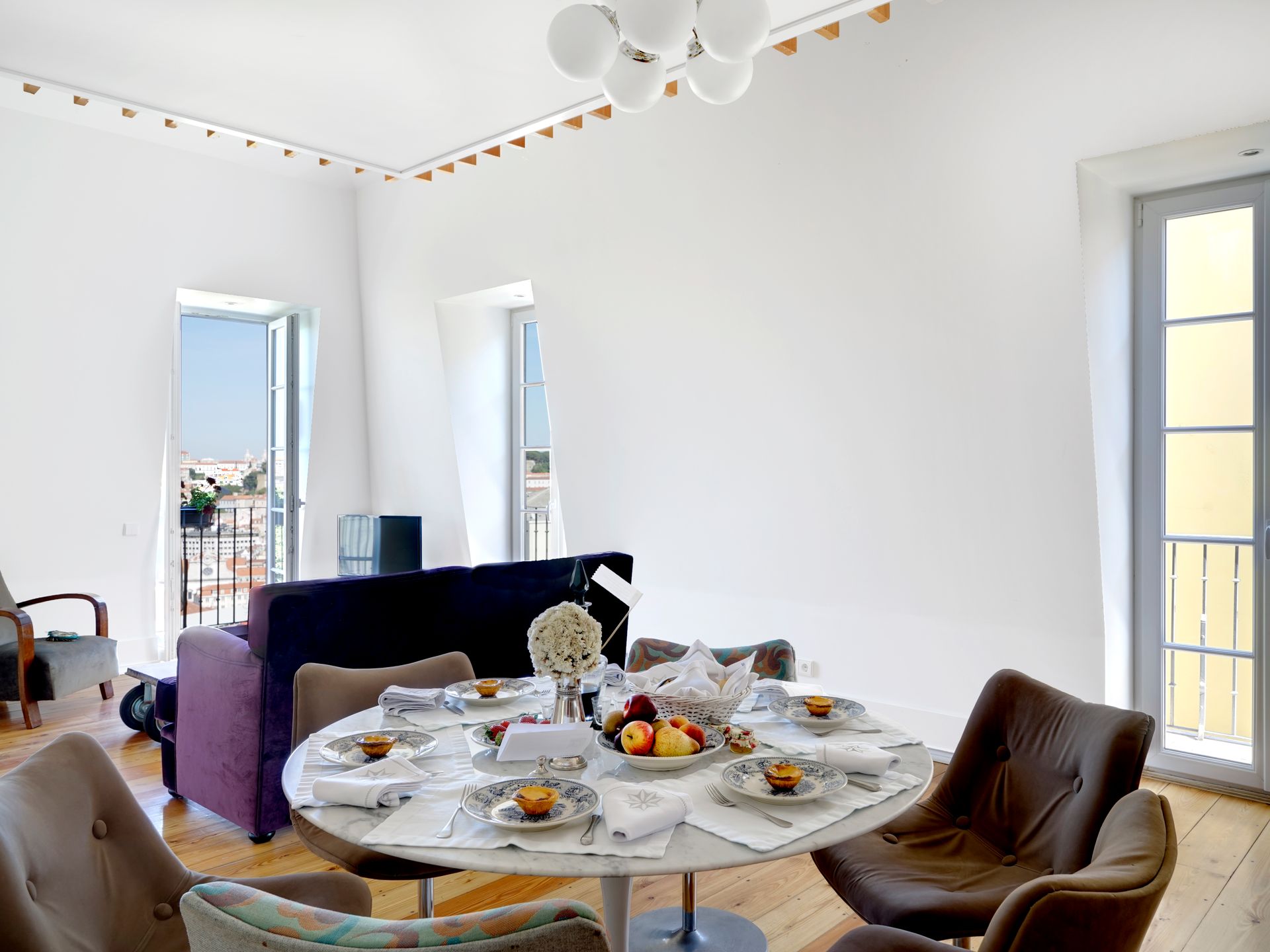 Dining area with natural light and a view in a spa penthouse two-bedroom apartment.
