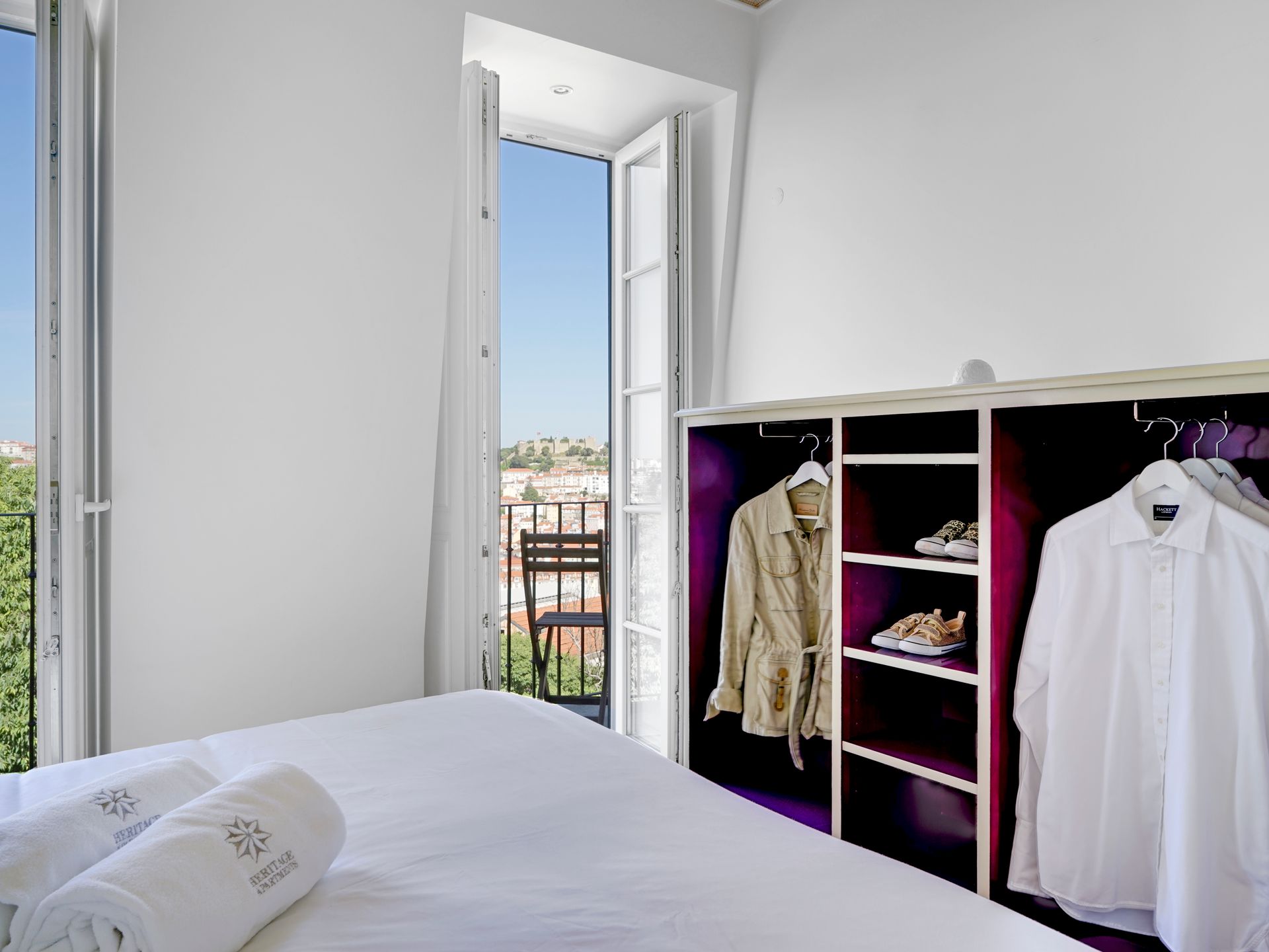Bedroom with wardrobe and view in a spa penthouse two-bedroom apartment.