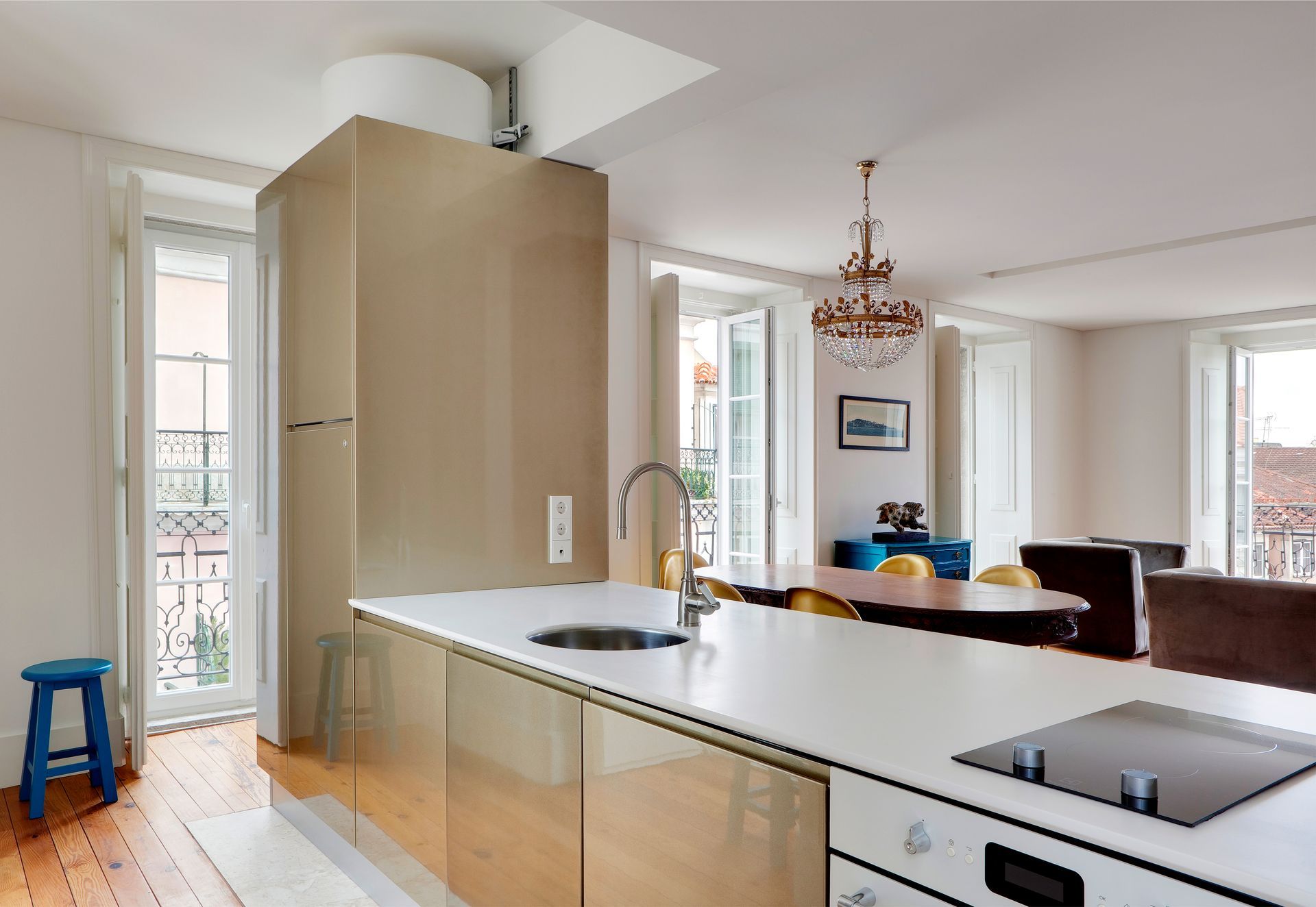Bright kitchen in a duplex two-bedroom apartment with modern appliances and white countertops.