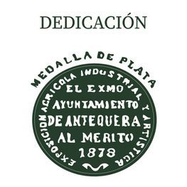 Dedicatoria sobre medalla circular verde de plata del Ayuntamiento de Antequera de 1878