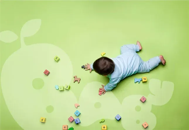 Baby playing with educational blocks