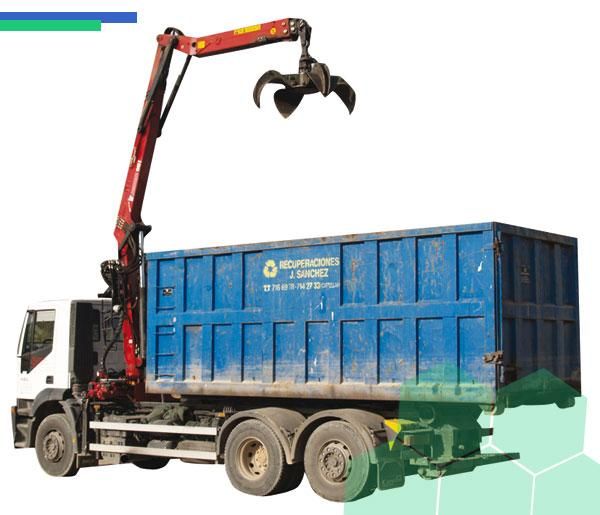 Un camión volquete azul con una grúa acoplada.