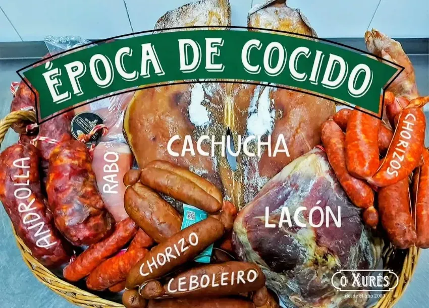 Assorted cured meats labeled “Época de Cocido,” with chorizo, lacón, cachucha, and ribo on display.