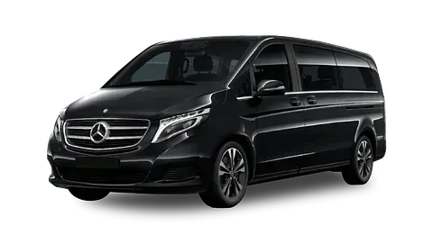 Furgoneta Mercedes-Benz negra, posiblemente una Clase V, estacionada en ángulo; se muestra el frente y el costado del vehículo.