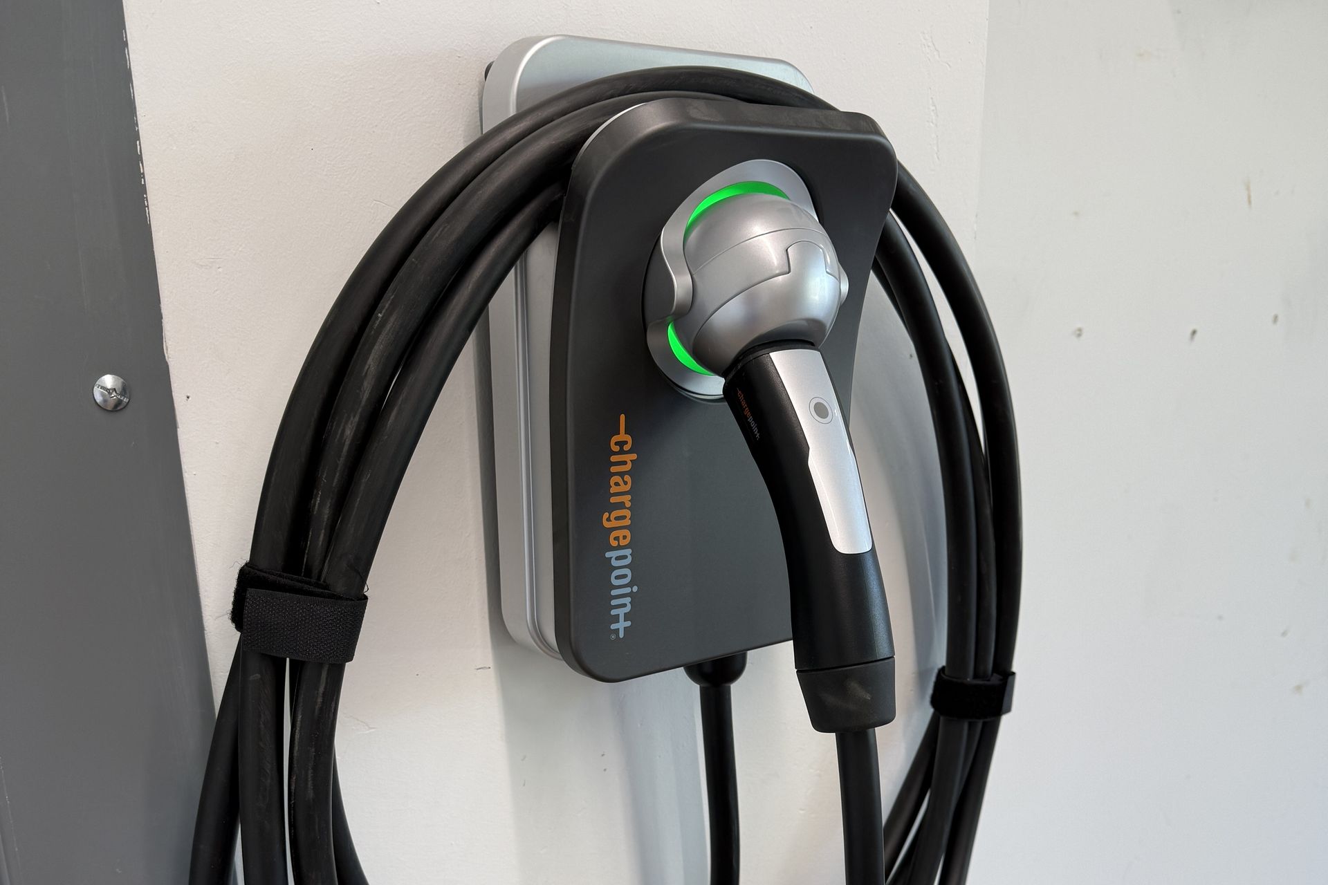 Level 2 EV charging station located in the heated 2-car garage, fully compatible with Tesla and standard electric vehicles.