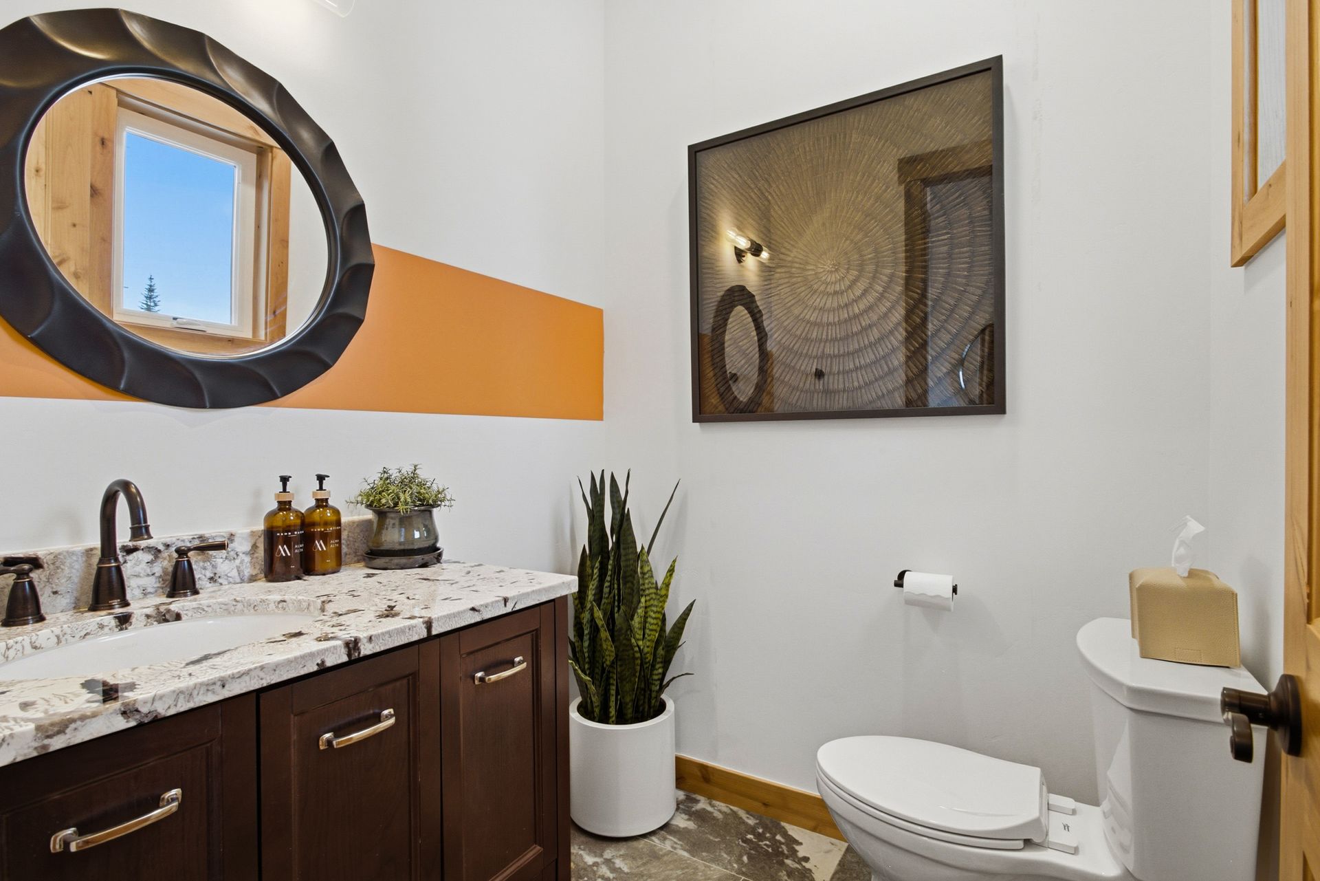 Additional main-level half bath for guest comfort, convenience, and privacy.