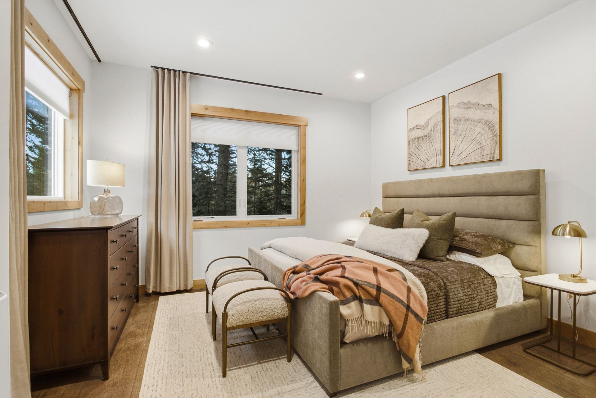 Inviting guest bedroom beautifully styled with warm mountain decor and premium linens.