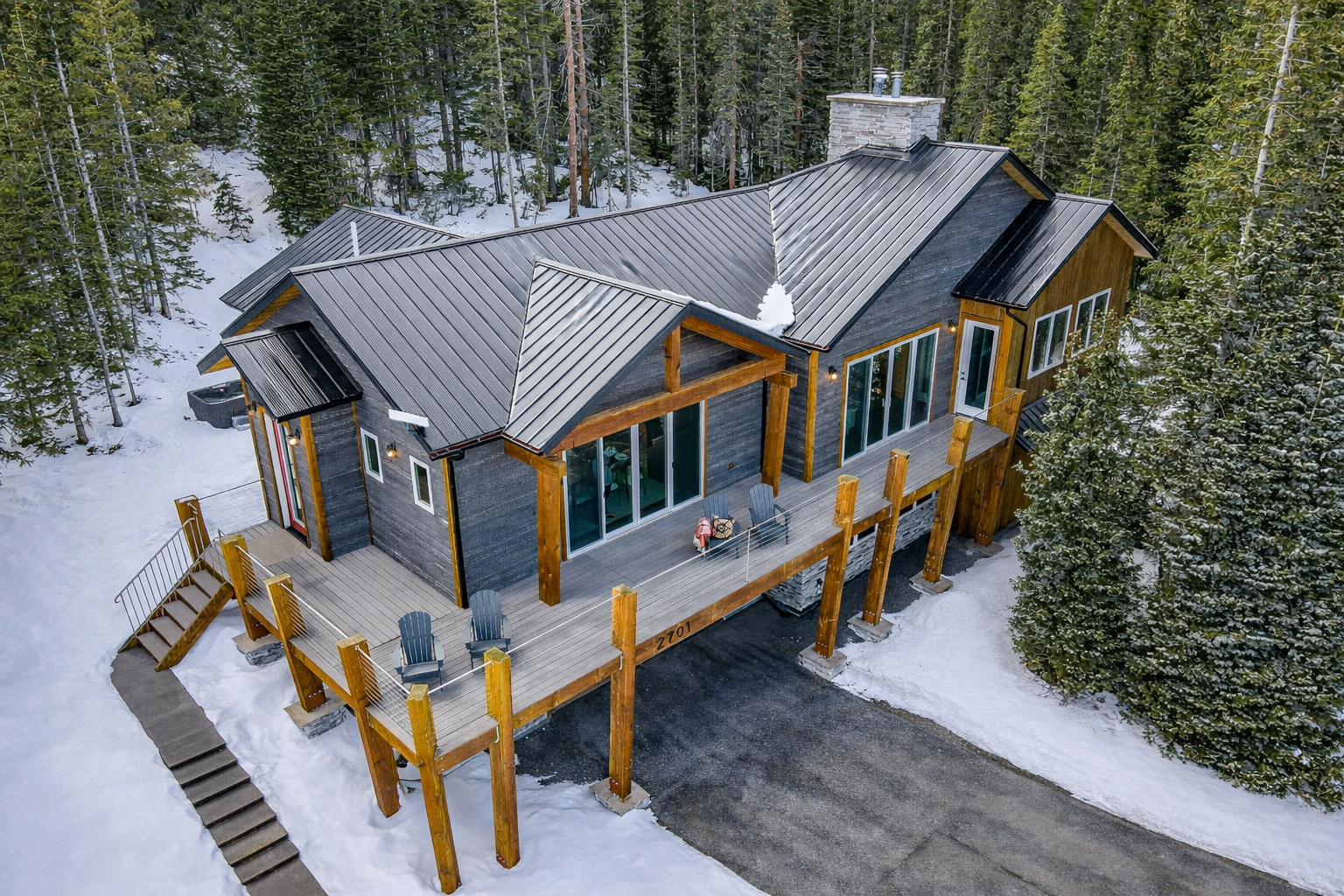 Beautiful luxury mountain home vacation rental completely surrounded by towering Colorado pines.