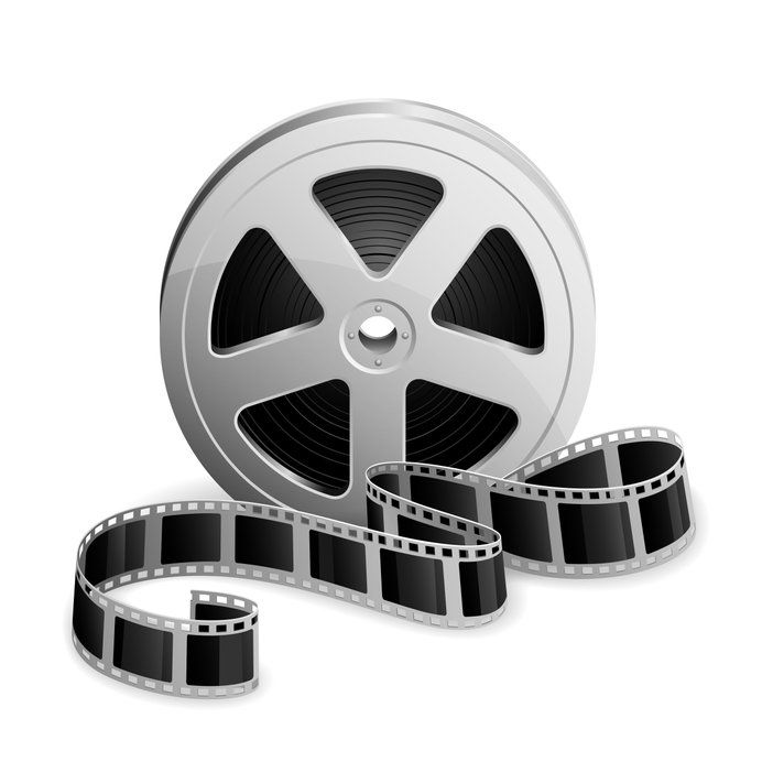 Un carrete de película con un rollo de película al lado