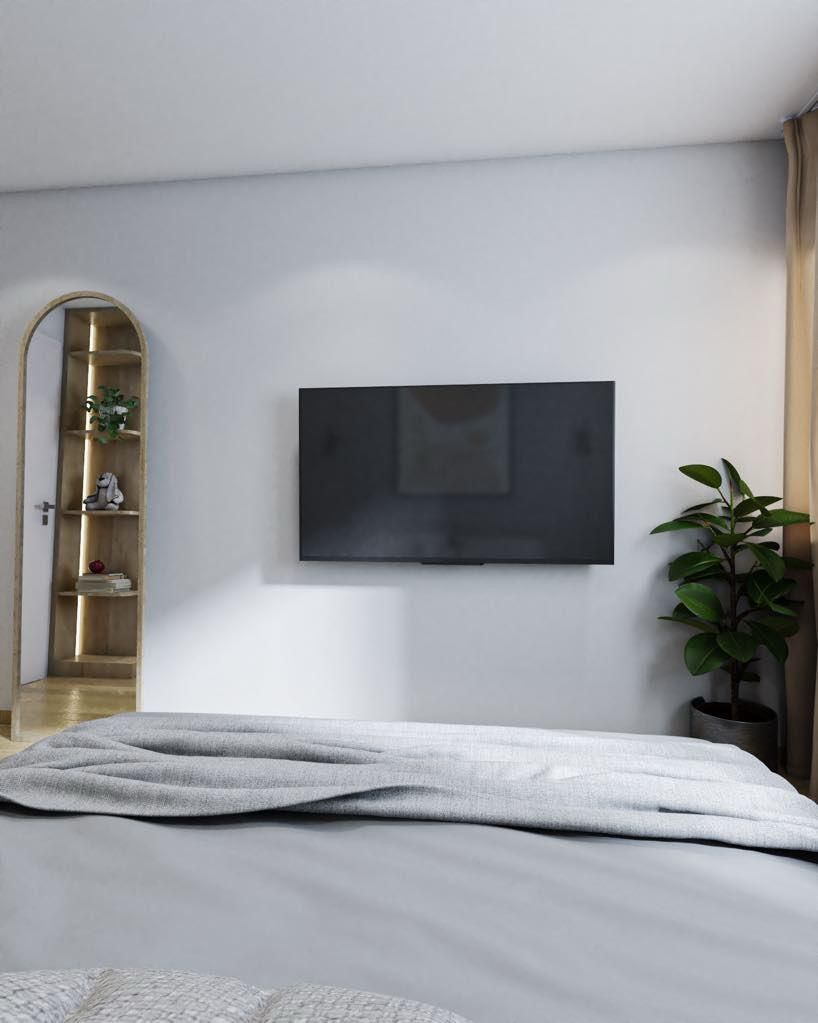 Télévision accrochée au mur d'une chambre