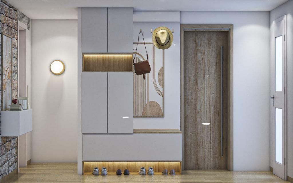 Entrée face à la porte avec rangement pour les chaussures et manteaux