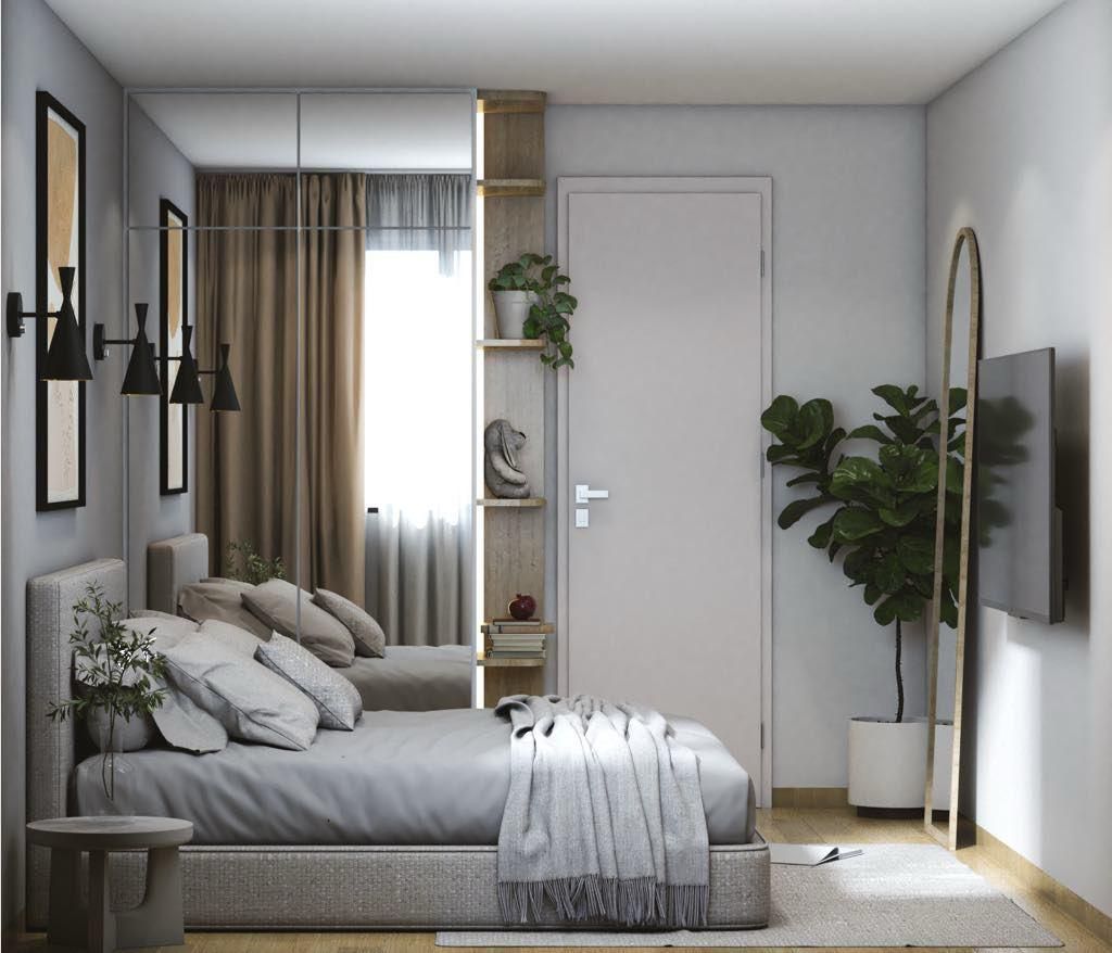 Chambre avec lit vu de côté, un dressing et un miroir
