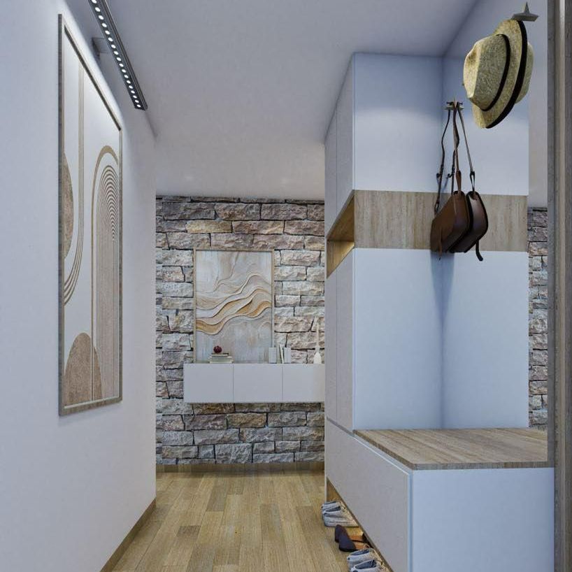 Vue de l'entrée d'une maison avec mur du fond en fausses pierres