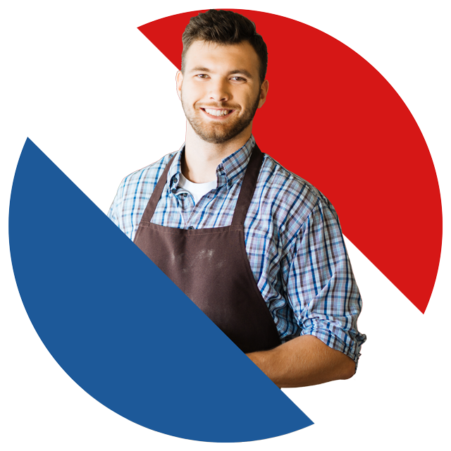 Professionnel qui souris en tenant sa perceuse