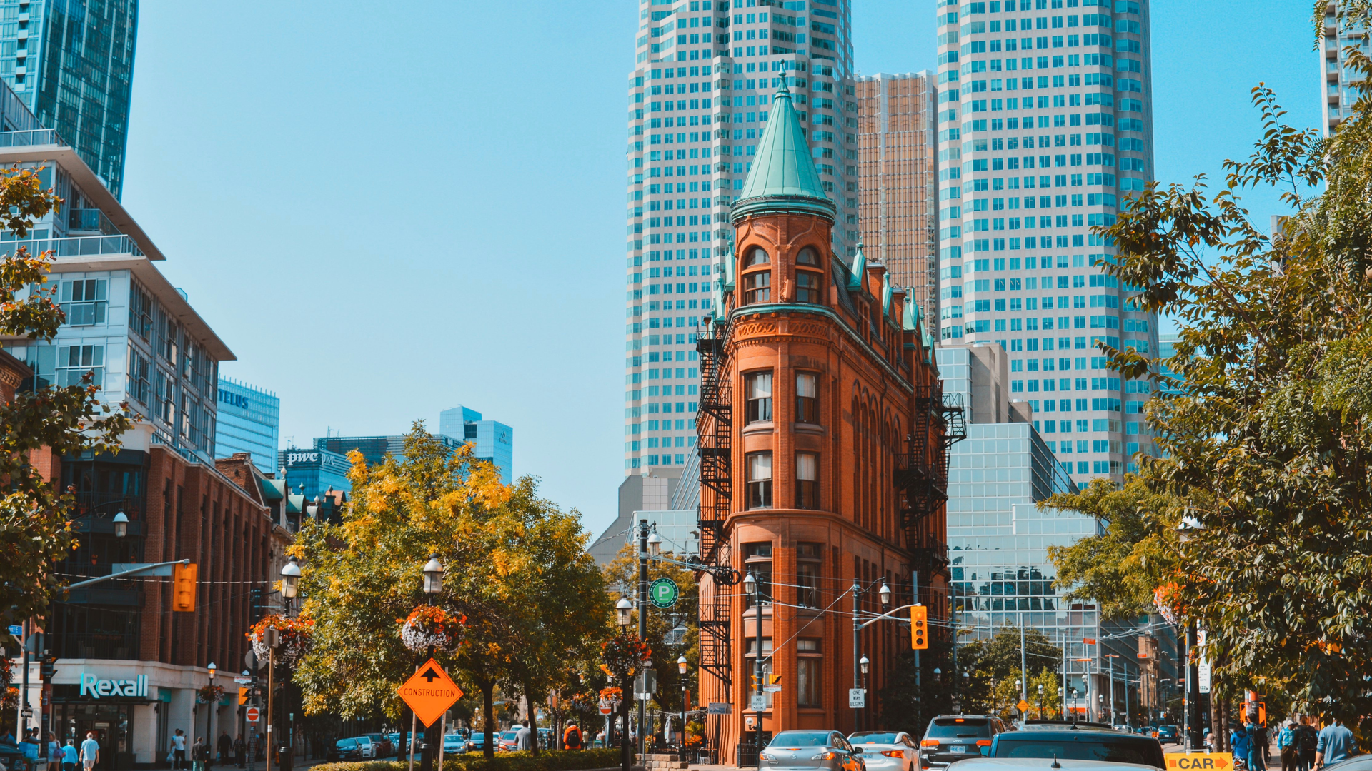 The historic Gooderham Building in downtown Toronto surrounded by modern skyscrapers.