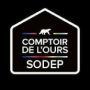 Logo noir d'un ours à l'intérieur d'une maison, texte « COMPTOIR DE L'OURS SODEP » sous l'ours.