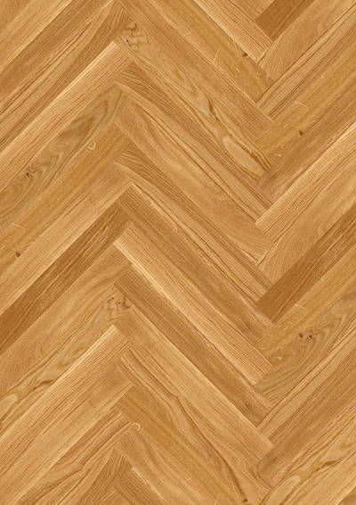 Eine Nahaufnahme eines Holzbodens mit Fischgrätenmuster.