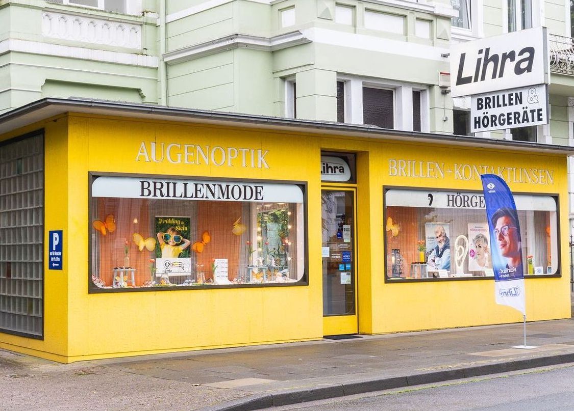 Ein gelbes Gebäude mit einem Schild mit der Aufschrift „Lihra“ darauf.