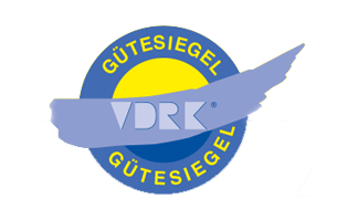 Ein blau-gelbes Logo mit der Aufschrift „Gutesiegel vdrk“