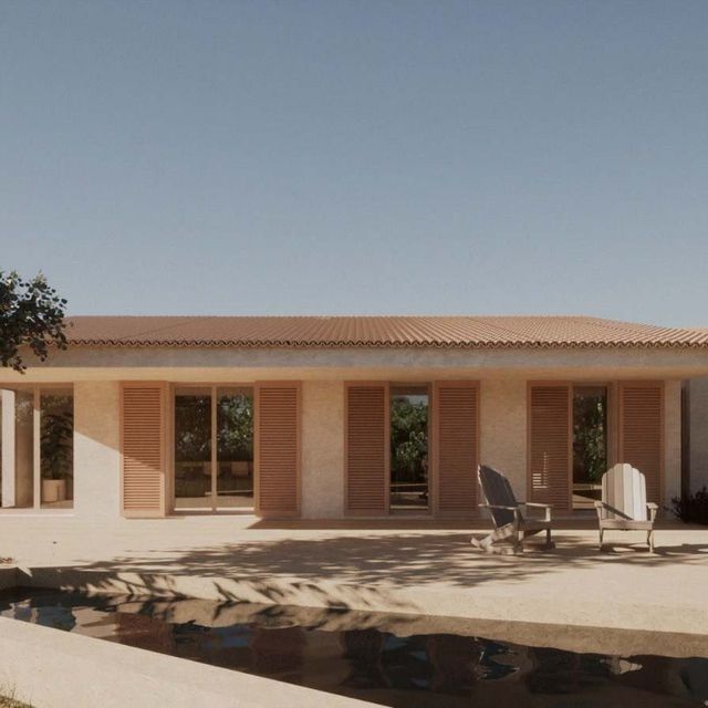 Una casa con piscina delante