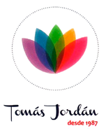 Logo for Tomás Jordán, featuring a colorful lotus flower inside a dotted circle and the text "Tomás Jordán desde 1987".