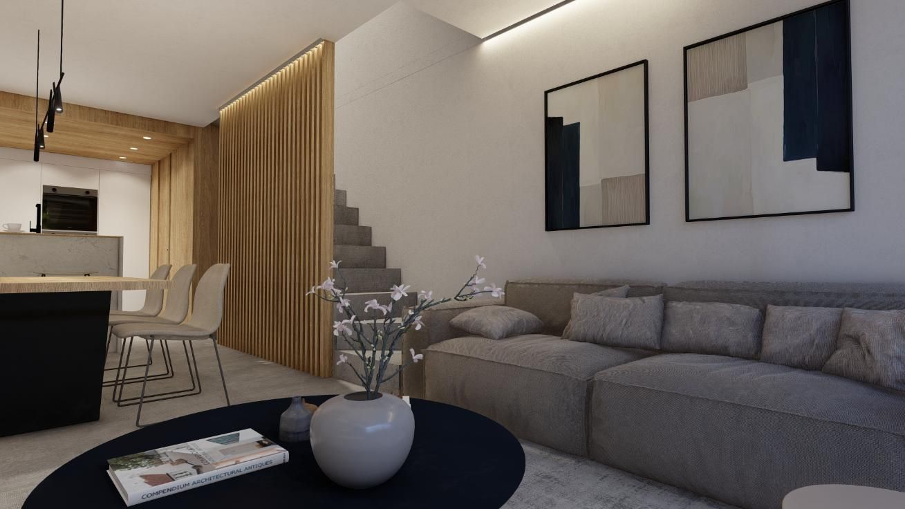 Sala de estar moderna con un sofá seccional gris, arte abstracto y una mesa de café oscura.