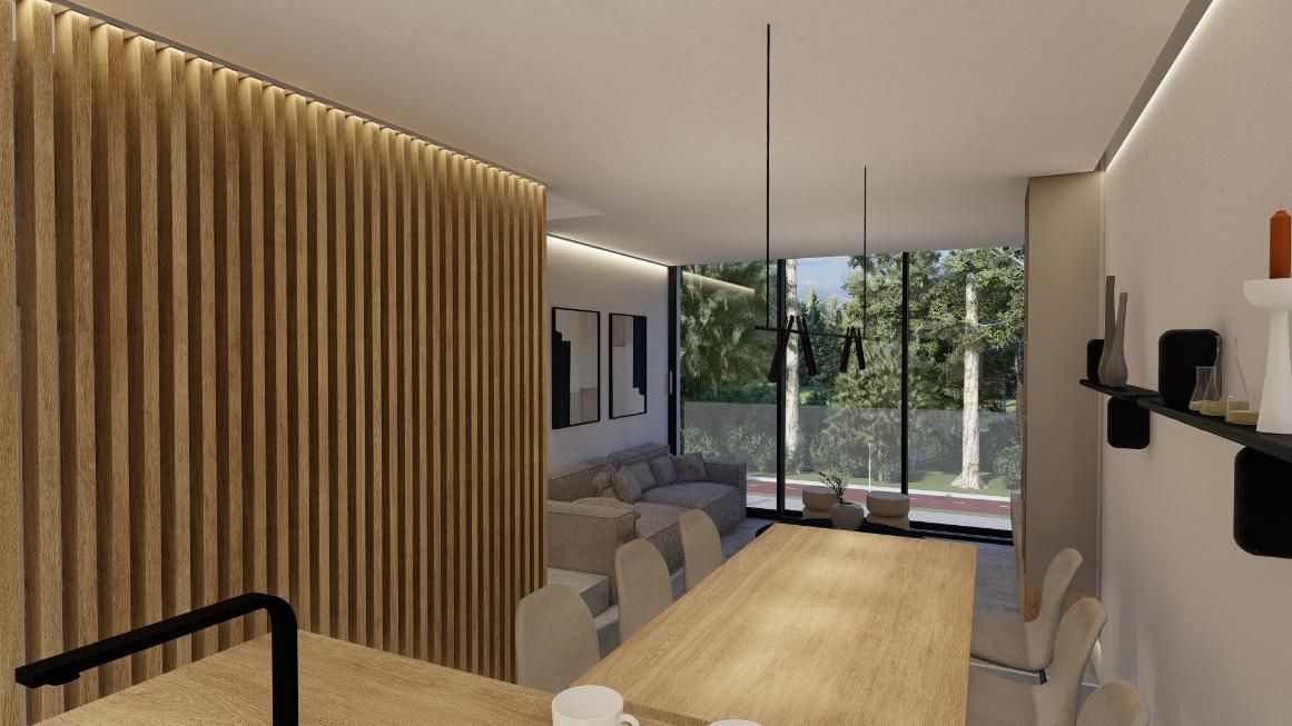 Comedor moderno con pared de listones de madera, mesa larga y vista a los árboles a través de una pared de vidrio.