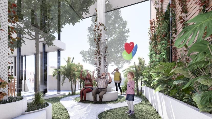 Personas en un jardín con un gran ventanal. Dos sentadas, una de pie, globos flotando. Follaje verde, detalles en blanco.