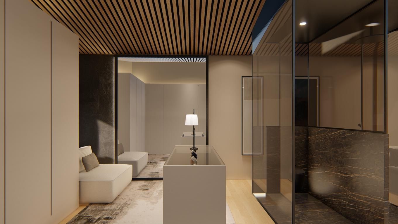 Moderno vestidor con muebles empotrados, tocador central y ducha con mampara de cristal.